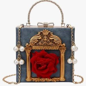 Elegant Blue and Gold Handbag with Red Rose Accent